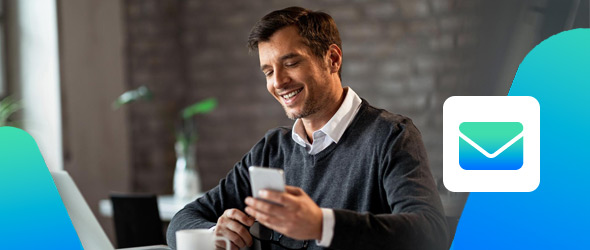 Mid thirties man smiling holding a phone